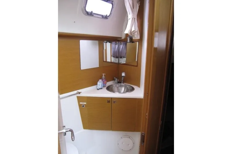 Slide: The Image of Bathroom interior of 2013 Jeanneau Sun Odyssey 44i yacht with sink and mirror. - 15