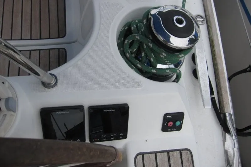 Slide: The Image of Cockpit controls of 2013 Jeanneau Sun Odyssey 44i sailboat with winch and Raymarine displays. - 22