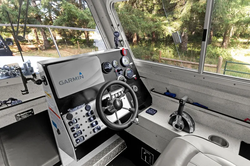 Slide: The Image of 2021 KingFisher 2625 Coastal Express helm with Garmin navigation system and control panel. - 31