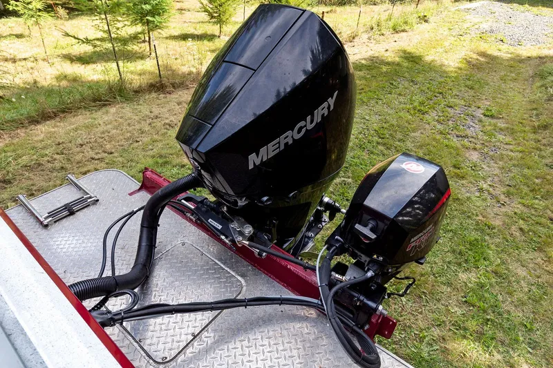 Slide: The Image of Outboard motors on a 2021 KingFisher 2625 Coastal Express boat, parked on grass. - 22