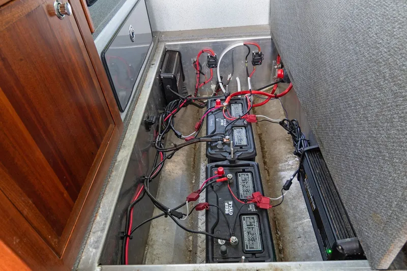 Slide: The Image of Battery compartment of 2021 KingFisher 2625 Coastal Express boat, showing wiring and connections. - 41