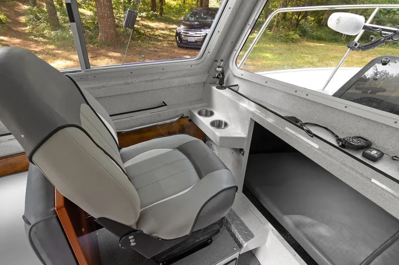 Slide: The Image of Interior of 2021 KingFisher 2625 Coastal Express boat with seating and control panel. - 34