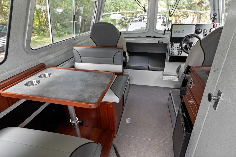 Slide: The Image of Interior of 2021 KingFisher 2625 Coastal Express boat with seating and navigation equipment. - 28