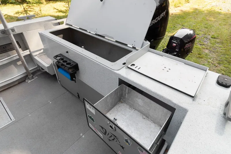 Slide: The Image of Interior view of 2021 KingFisher 2625 Coastal Express boat with storage compartments open. - 43