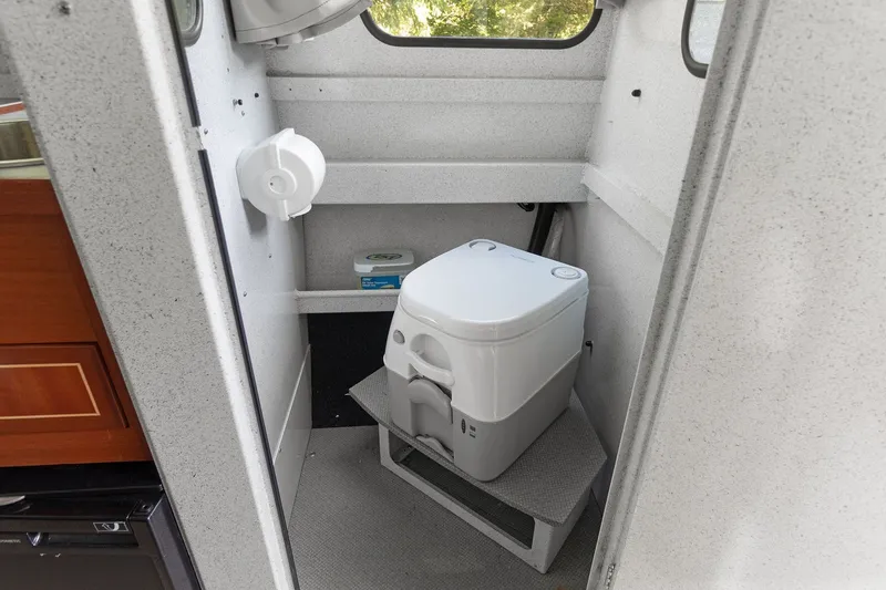 Slide: The Image of Compact marine toilet in 2021 KingFisher 2625 Coastal Express boat interior. - 36