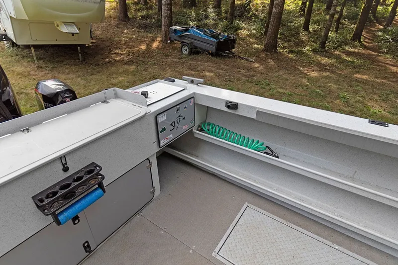 Slide: The Image of 2021 KingFisher 2625 Coastal Express boat interior with storage and fishing equipment. - 19