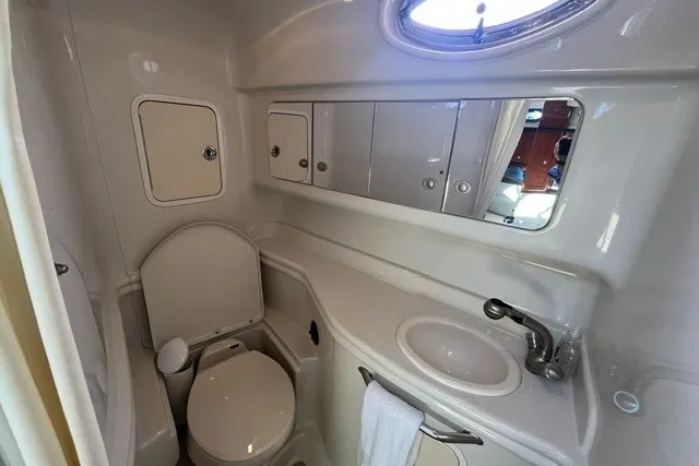 Slide: The Image of 2007 Sea Ray Sundancer 320 bathroom with sink, toilet, and storage cabinets. - 41