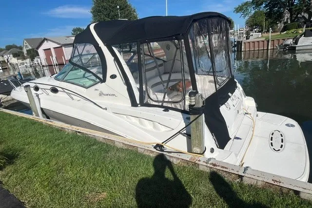 Slide: The Image of 2007 Sea Ray Sundancer 320 docked by a grassy shoreline. - 4