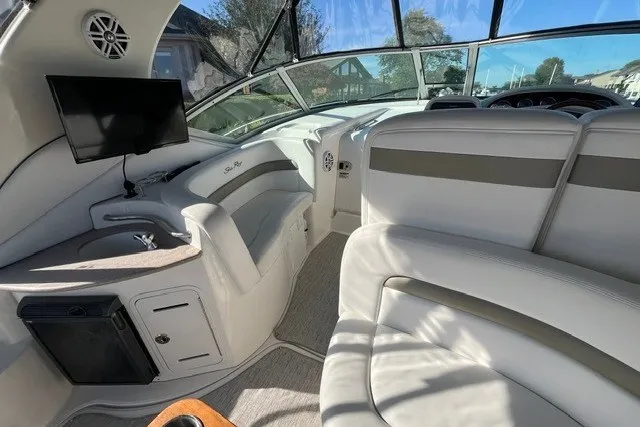 Slide: The Image of Interior of a 2007 Sea Ray Sundancer 320 yacht with plush seating and modern amenities. - 19