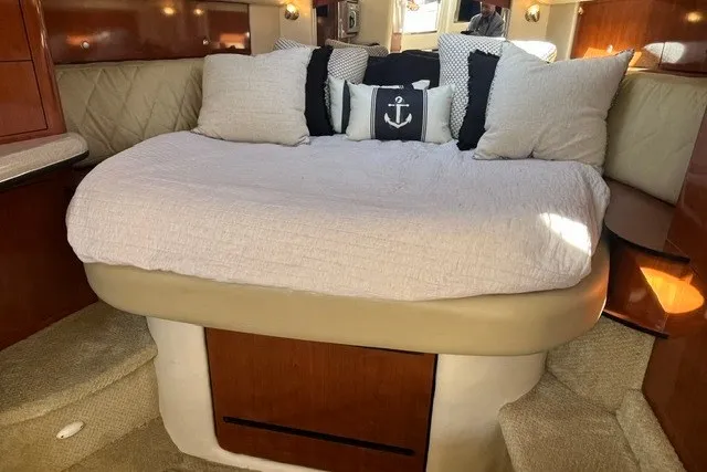 Slide: The Image of Luxurious cabin interior of 2007 Sea Ray Sundancer 320 with cozy bedding and nautical decor. - 45