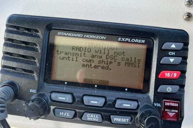 Slide: The Image of Standard Horizon Explorer radio displaying MMSI entry warning on a 2007 Sea Ray Sundancer 320. - 14