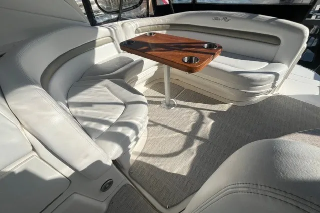 Slide: The Image of Luxurious interior of 2007 Sea Ray Sundancer 320 with plush seating and wooden table. - 28
