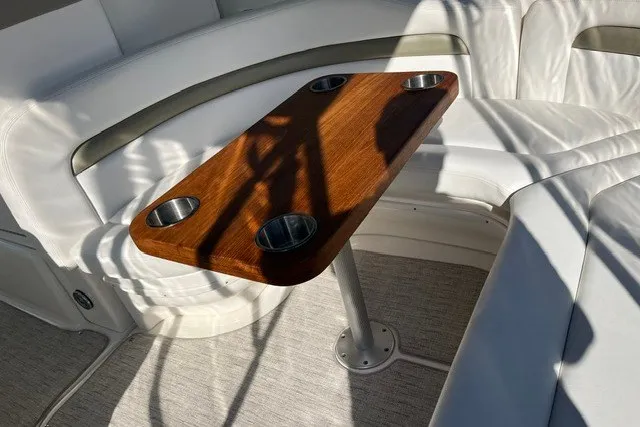 Slide: The Image of Luxurious 2007 Sea Ray Sundancer 320 interior with wooden table and white seating. - 26