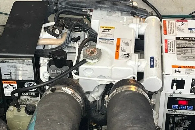 Slide: The Image of Engine compartment of a 2007 Sea Ray Sundancer 320 with Kohler generator components. - 56