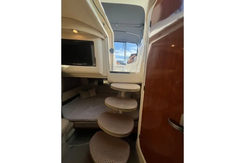 Slide: The Image of Interior of 2007 Sea Ray Sundancer 320 with steps and cozy seating area. - 33