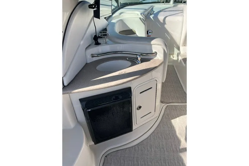 Slide: The Image of 2007 Sea Ray Sundancer 320 interior with sink, mini-fridge, and storage cabinet. - 21