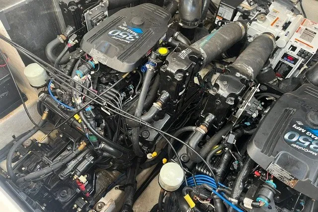 Slide: The Image of Engine compartment of a 2007 Sea Ray Sundancer 320, showcasing dual 350 MAG MPI engines. - 54