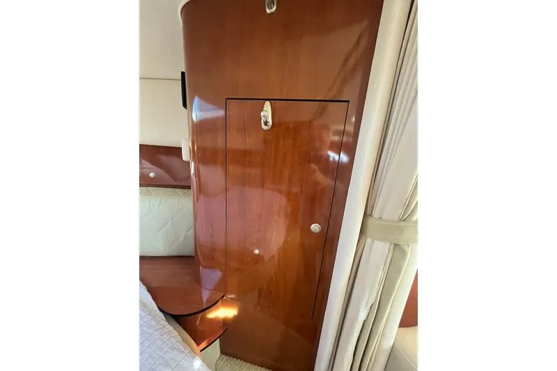 Slide: The Image of Interior cabin of 2007 Sea Ray Sundancer 320 with polished wood finish. - 47
