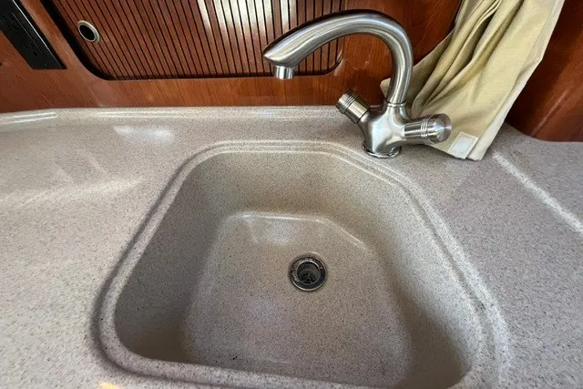 Slide: The Image of Kitchen sink and faucet in 2007 Sea Ray Sundancer 320 yacht interior. - 37