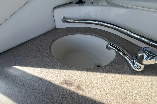 Slide: The Image of 2007 Sea Ray Sundancer 320 boat sink with chrome faucet and countertop. - 24