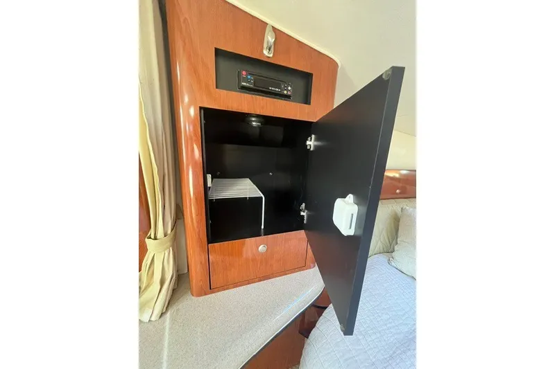 Slide: The Image of Open cabinet in 2007 Sea Ray Sundancer 320 interior, showcasing storage space. - 35