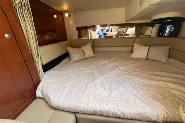 Slide: The Image of Interior cabin of 2007 Sea Ray Sundancer 320 with cozy bed and pillows. - 50