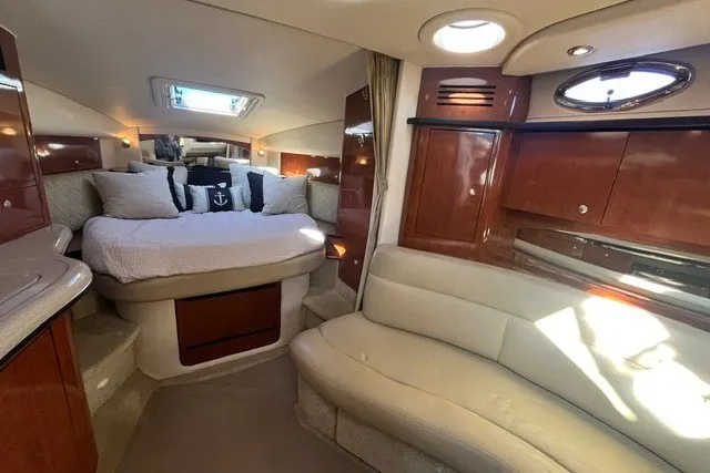 Slide: The Image of Luxurious interior of 2007 Sea Ray Sundancer 320 yacht with cozy seating and elegant wood finishes. - 29