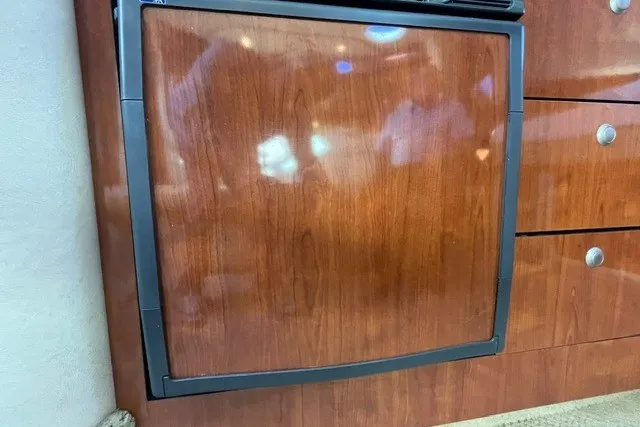 Slide: The Image of Wood-paneled refrigerator in 2007 Sea Ray Sundancer 320 yacht interior. - 39