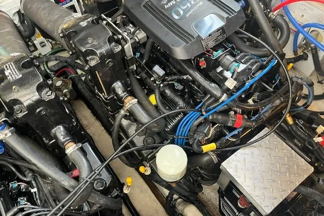 Slide: The Image of Engine compartment of a 2007 Sea Ray Sundancer 320 boat, showcasing mechanical components. - 55