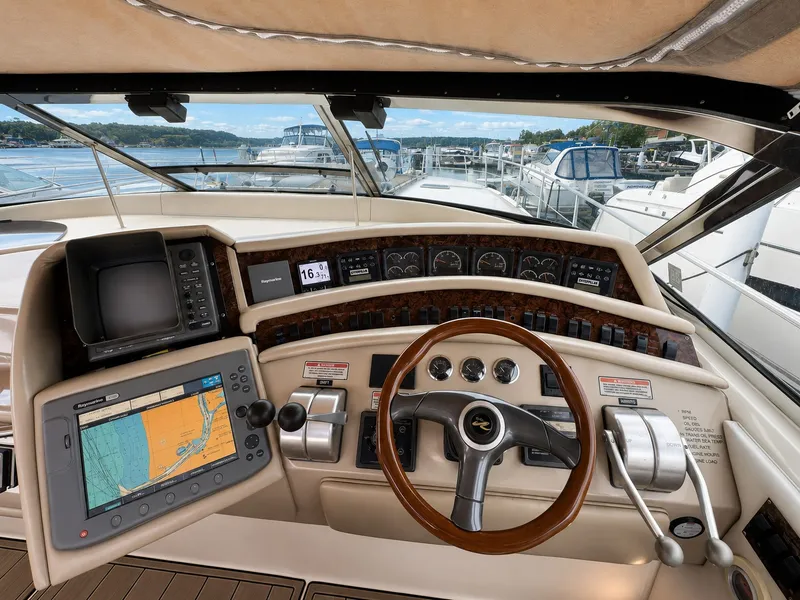 Slide: The Image of The 1999 Sea Ray 500 Sundancer cockpit features a sleek design with modern instruments. - 20