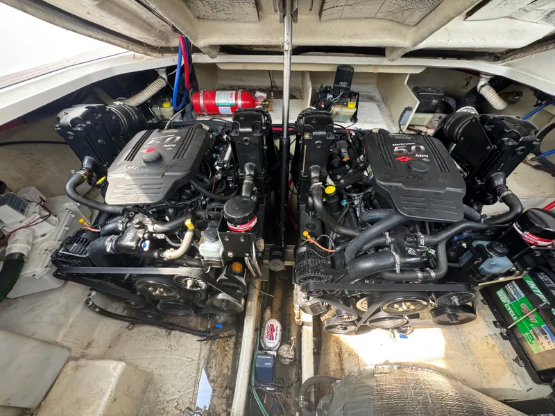 Slide: The Image of Two powerful engines in the engine room of a 2008 Sea Ray 290 Sundancer. - 21