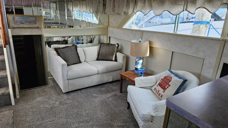 Slide: The Image of Interior of a 1971 Chris-Craft 47 Commander with a sofa, armchair, and lamp. - 20