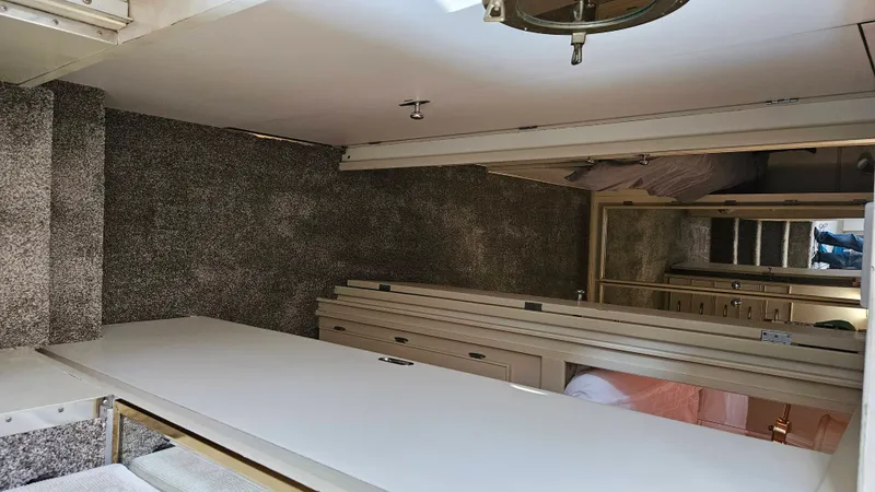 Slide: The Image of Interior of a 1971 Chris-Craft 47 Commander with carpeted flooring and wooden furnishings. - 37