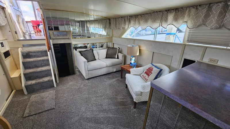 Slide: The Image of Interior of a 1971 Chris-Craft 47 Commander with cozy sofa and carpeted floor. - 21