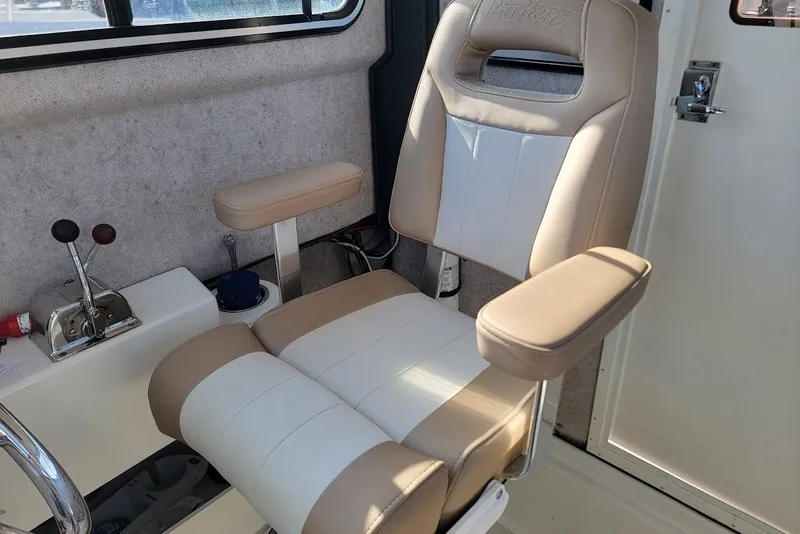 Slide: The Image of Captain's chair in 2017 Parker 2120 Sport Cabin boat interior. - 3