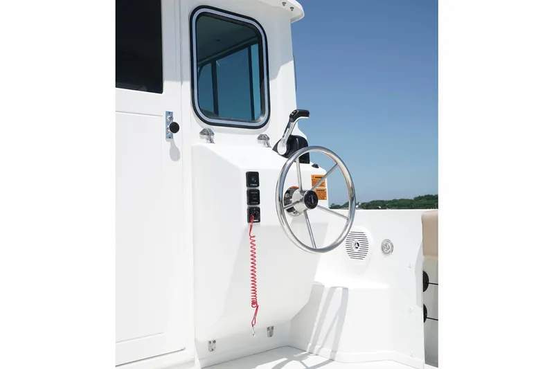 Slide: The Image of Manufacturer Provided Image: 2017 Parker 2120 Sport Cabin boat steering console with controls. - 5