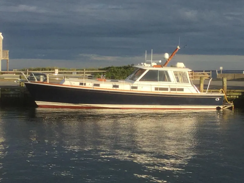 Slide: The Image of 2004 Grand Banks 49 Eastbay HX yacht docked at sunset. - 29