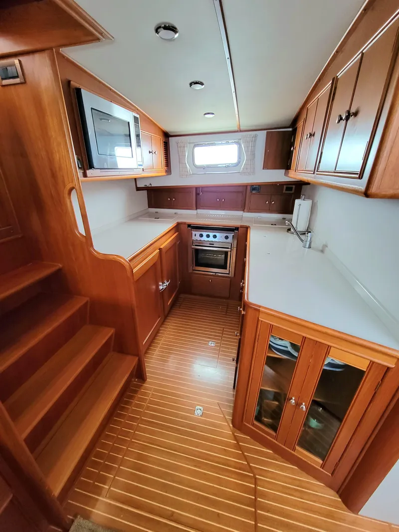 Slide: The Image of Interior view of a 2004 Grand Banks 49 Eastbay HX yacht kitchen. - 17