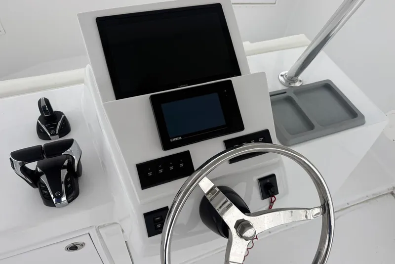 Slide: The Image of Helm of 1984 Ocean 55 Super Sport yacht with modern controls and displays. - 17