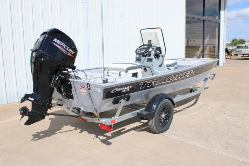 Slide: The Image of 2027 Tracker Bass Tracker Classic CC boat with Mercury engine on trailer. - 14
