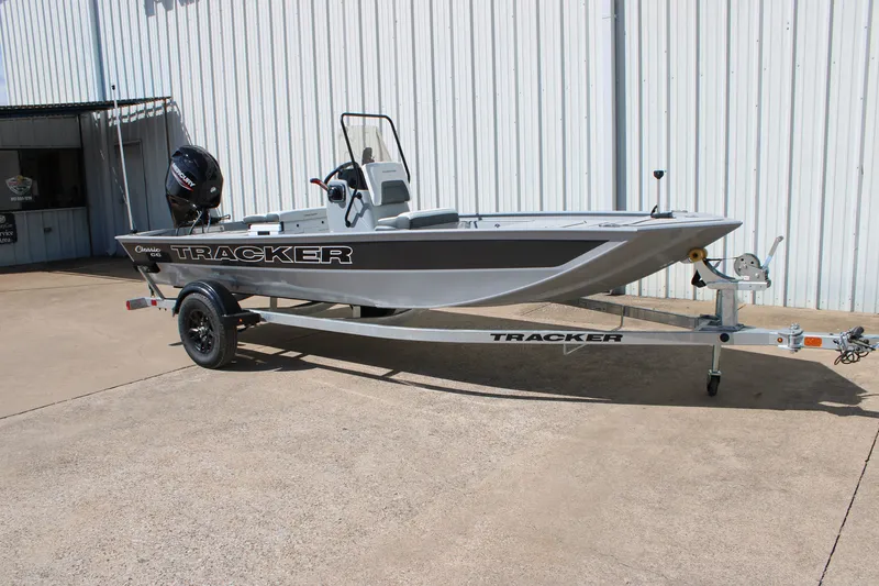 The Image of 2027 Tracker Bass Tracker Classic CC boat on trailer, parked outdoors. - 0