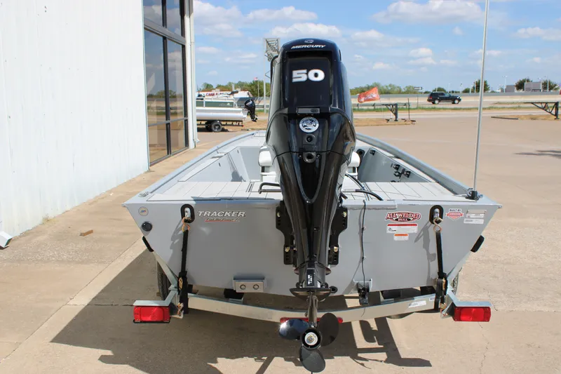 Slide: The Image of 2027 Tracker Bass Tracker Classic CC boat with Mercury 50 engine, parked outdoors. - 13