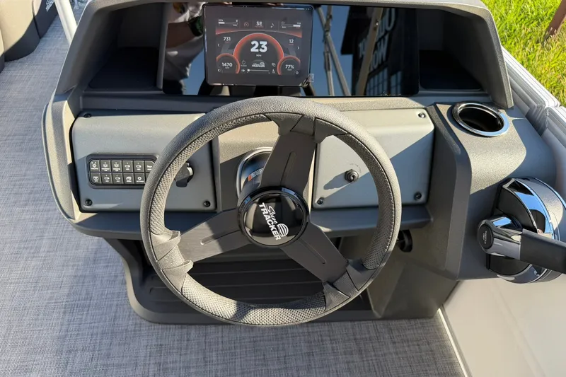 Slide: The Image of Steering console of 2027 Sun Tracker Party Barge 22 RF DLX with digital display. - 20