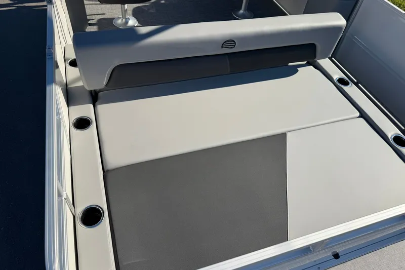 Slide: The Image of 2027 Sun Tracker Party Barge 22 RF DLX boat seating area with cup holders. - 27