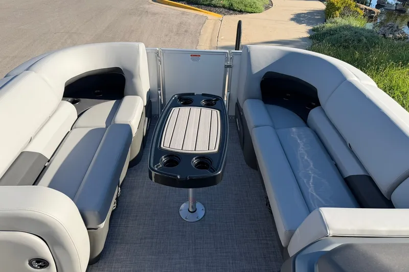 Slide: The Image of Interior of 2027 Sun Tracker Party Barge 22 RF DLX with seating and table. - 16