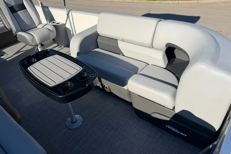 Slide: The Image of 2027 Sun Tracker Party Barge 22 RF DLX interior with seating and table. - 15