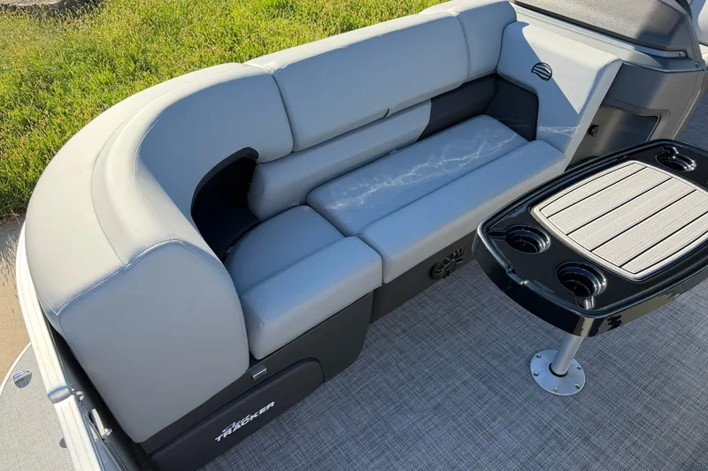Slide: The Image of 2027 Sun Tracker Party Barge 22 RF DLX with gray seating and a sleek table. - 14