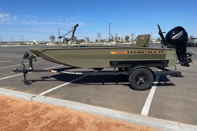 The Image of 2027 Tracker Grizzly 1553 Timber boat on trailer in parking lot. - 0
