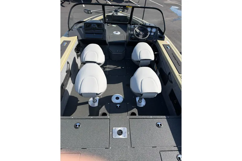 Slide: The Image of 2027 Tracker Targa V-18 WT boat interior with four white seats and control panel. - 36