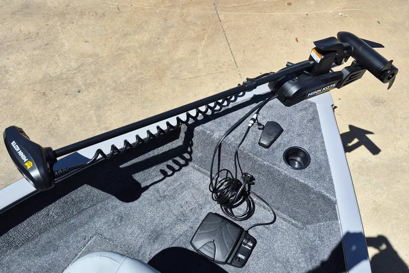 Slide: The Image of Minn Kota trolling motor on 2027 Tracker Super Guide V-16 SC boat deck. - 14